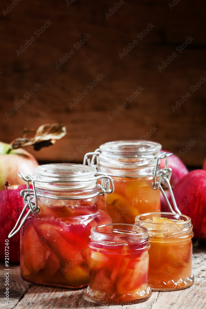 Autumn apple jam ripe red apples in jars on an old wooden table, Autumn apple jam ripe red apples in jars on an old wooden table,