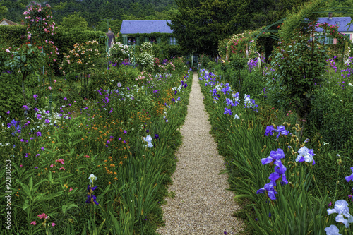 Fotografie A path divides colorful flowers in Monet's Garden