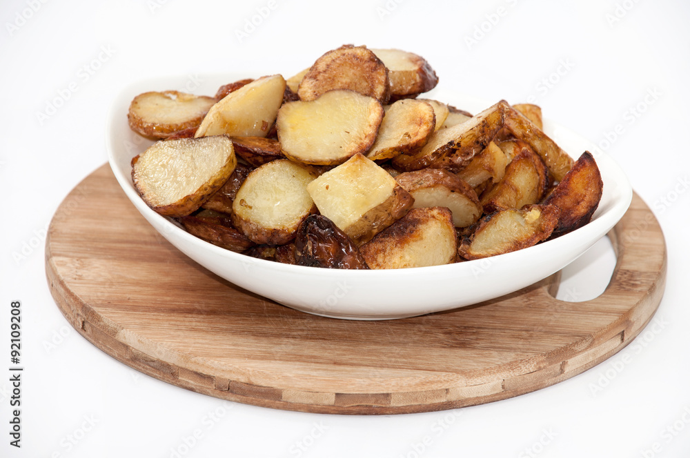 Young potatoes fried and served in the plate Young potatoes fried and served in the plate