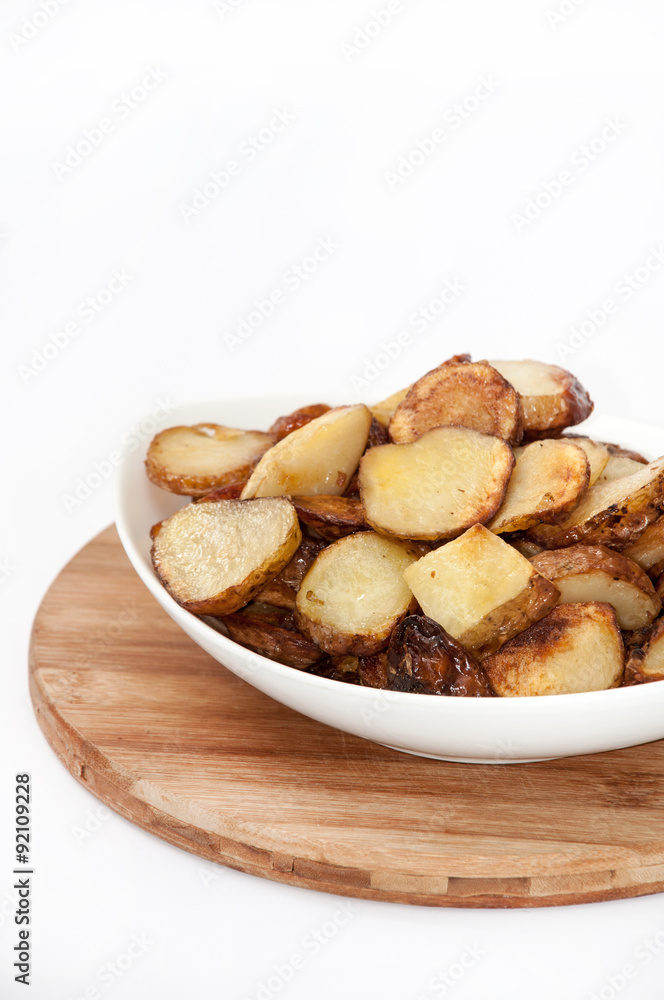Young potatoes fried and served in the plate Young potatoes fried and served in the plate