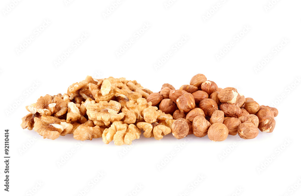 Pile of walnut kerneks and peeled hazelnuts isolated Pile of walnut kerneks and peeled hazelnuts isolated