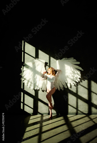 Woman with White Wings on Dark