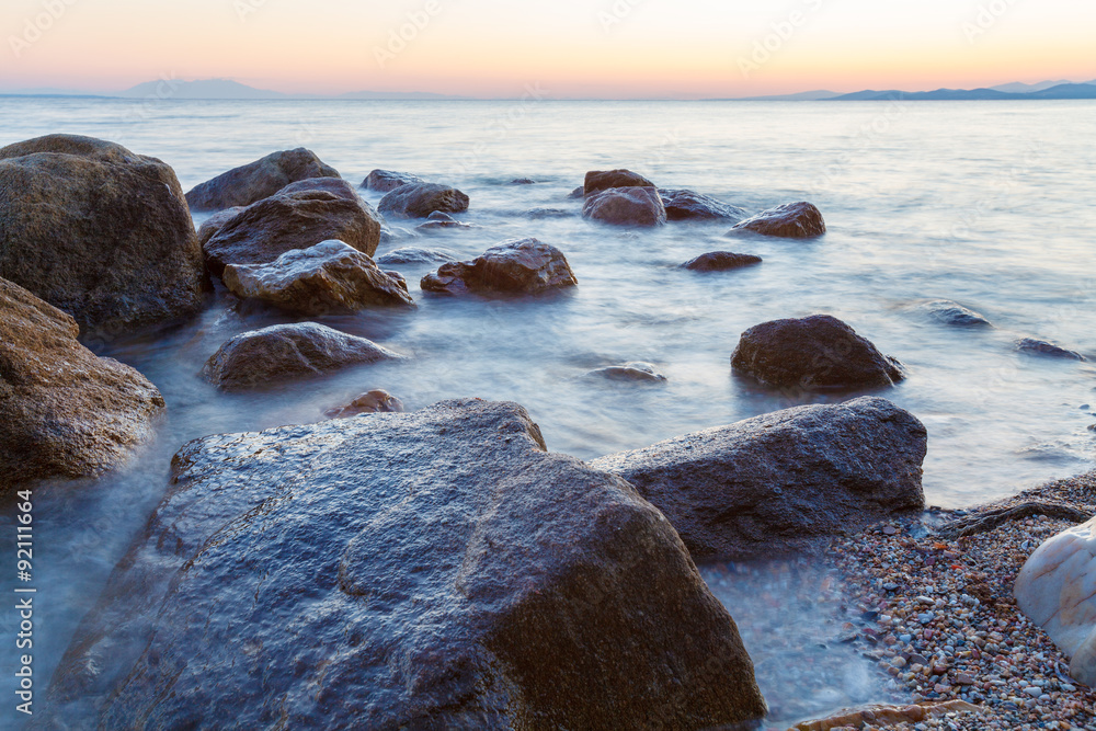 Landscape with Rocks and Waves at Sunset