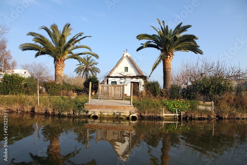 Schilderij op canvas Small farmhouse typical of Valencia,La Albufera nature reserve, El Palmar, Valencia, Comunidad Valenciana, Spain
