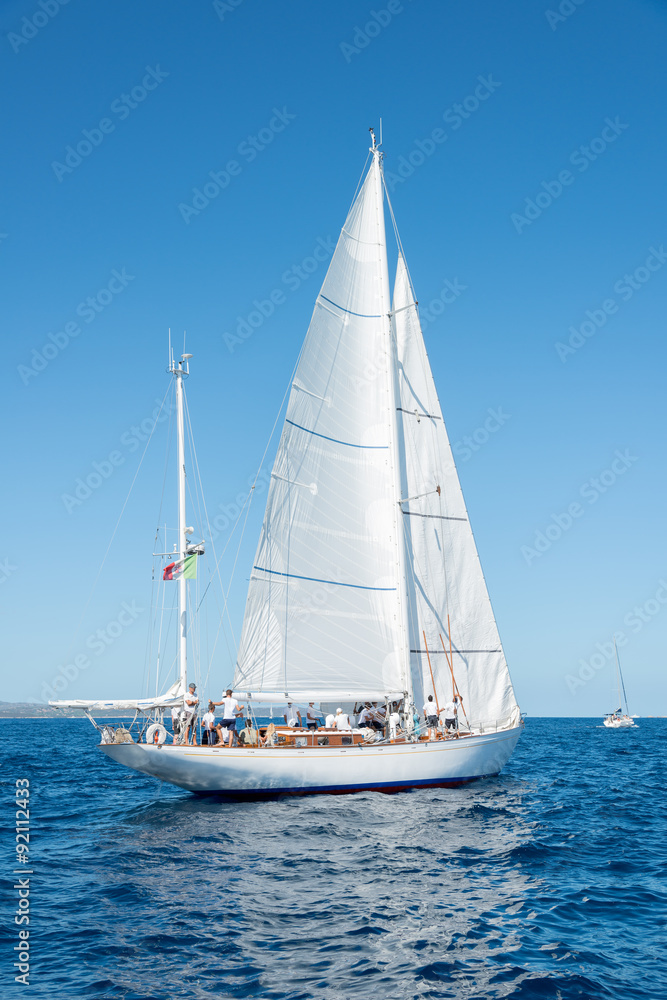 Elegant old italian style sailboat, on a wonderful blue sea, Sardinia, Italy