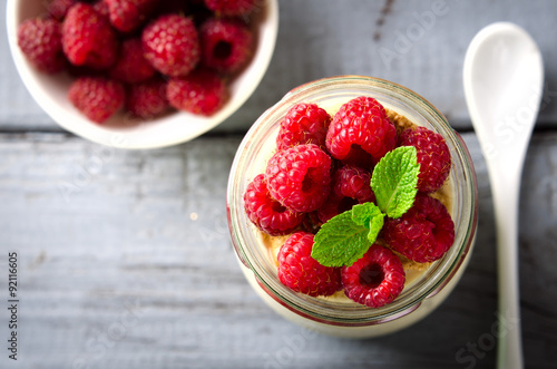 Healthy breakfast - fresh Greek yogurt with raspberries and mint
