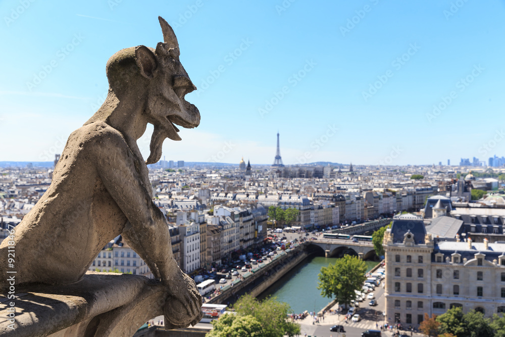 Famous Chimera (demon) overlooking the Eiffel Tower at a summer
