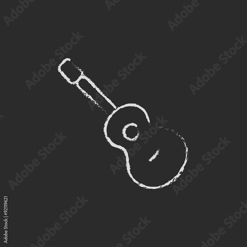 Guitar icon drawn in chalk.
