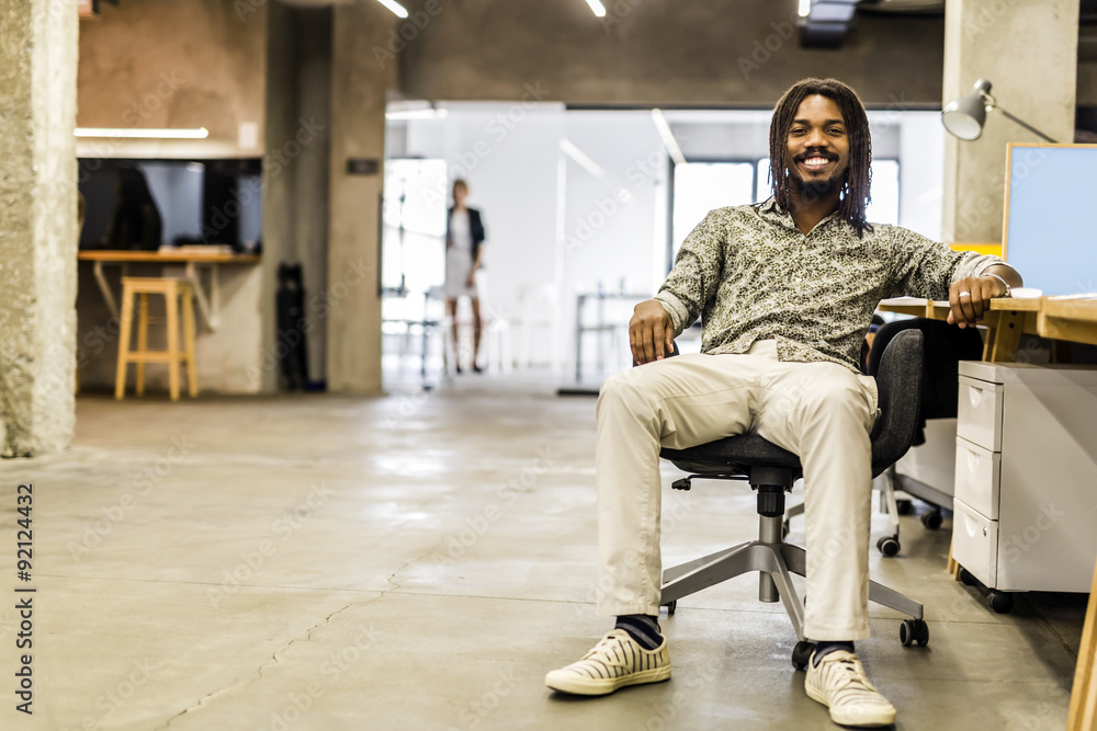 Handsome graphics designer sitting at a desk Handsome graphics designer sitting at a desk