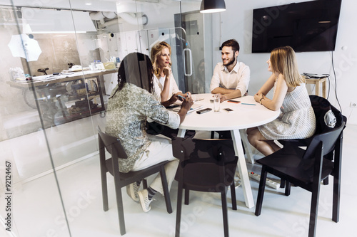 Coworkers having a meeting in a beautiful office