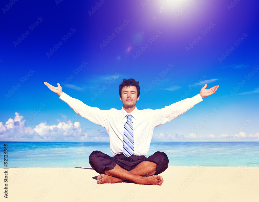 Businessman meditating on the beach Concept Businessman meditating on the beach Concept