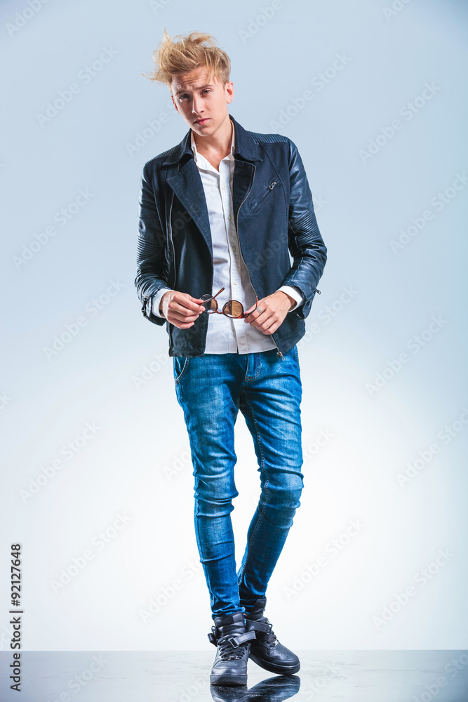 sexy blonde boy wearing jeans and leather jacket while Stock Photo | Adobe  Stock