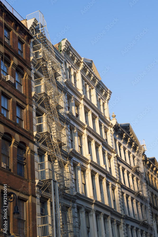 Golden hour view of traditional downtown New York City architecture in the SoHo cast iron historical district