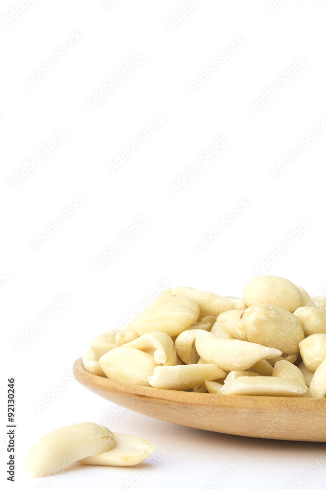 groundnuts on wooden spoon isolated on white background groundnuts on wooden spoon isolated on white background