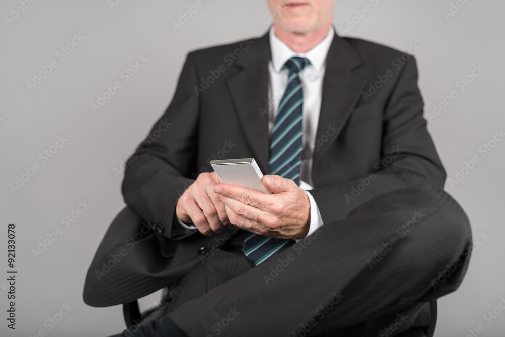 Businessman using his smartphone Businessman using his smartphone