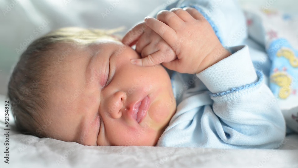 Close-up portrait of a beautiful sleeping baby on vintage suitcase Close-up portrait of a beautiful sleeping baby on vintage suitcase