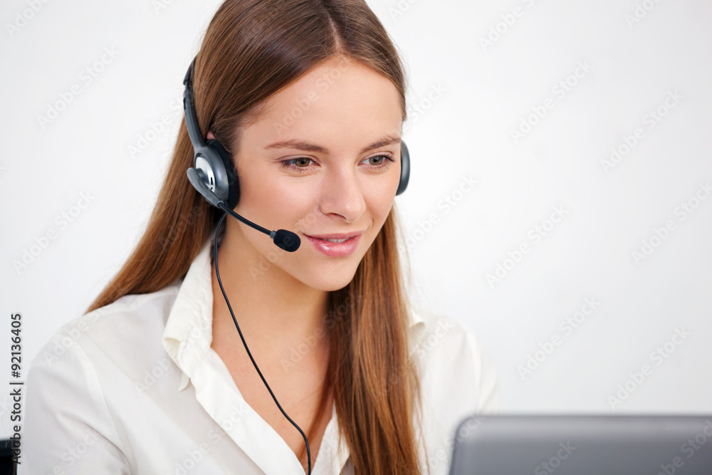 Portrait of happy young support phone operator with headset. Portrait of happy young support phone operator with headset.