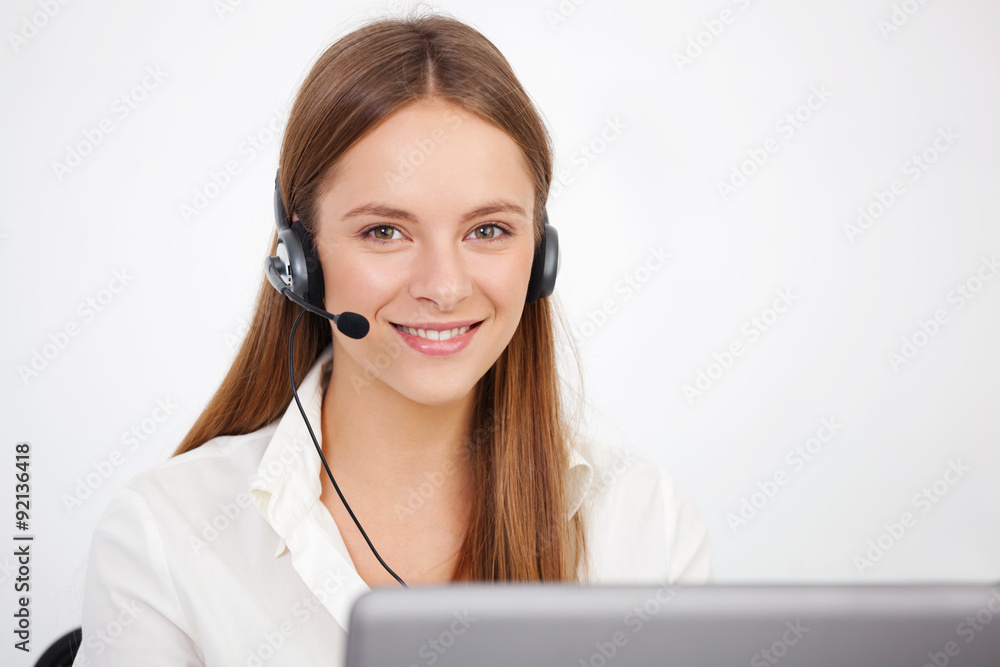Portrait of happy young support phone operator with headset. Portrait of happy young support phone operator with headset.