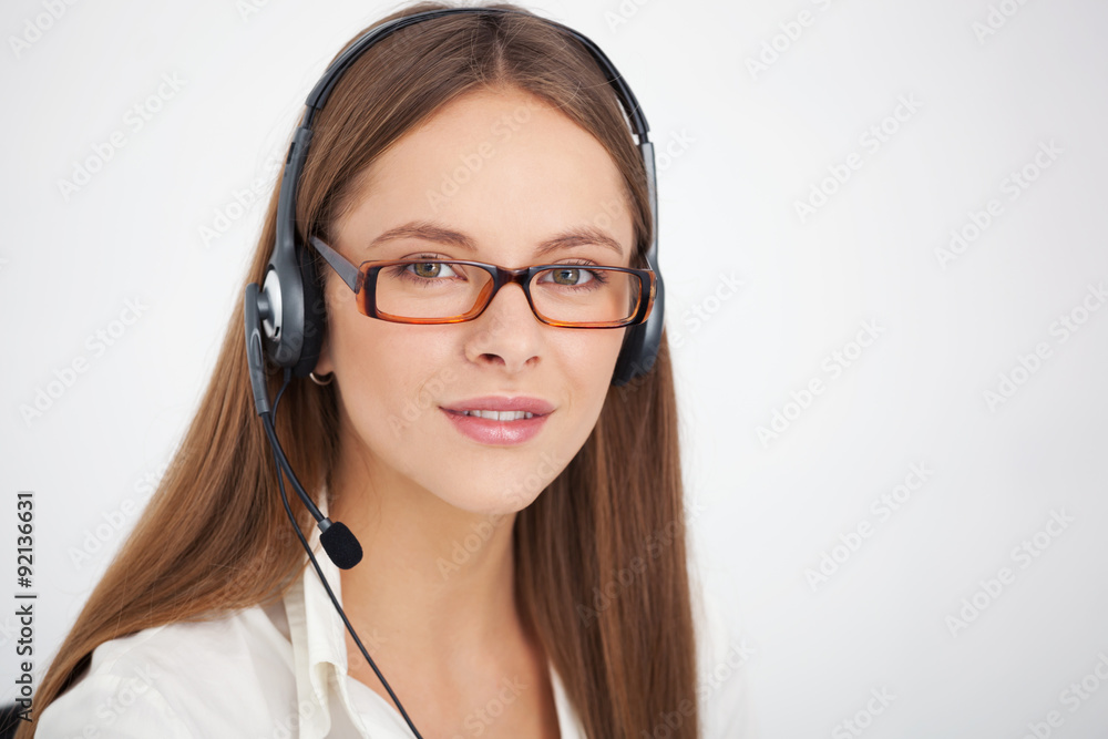 Portrait of happy young support phone operator with headset. Portrait of happy young support phone operator with headset.