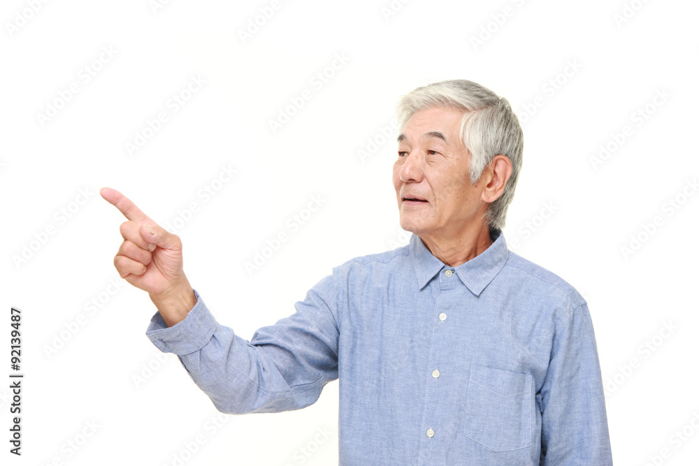 senior Japanese man presenting and showing something senior Japanese man presenting and showing something