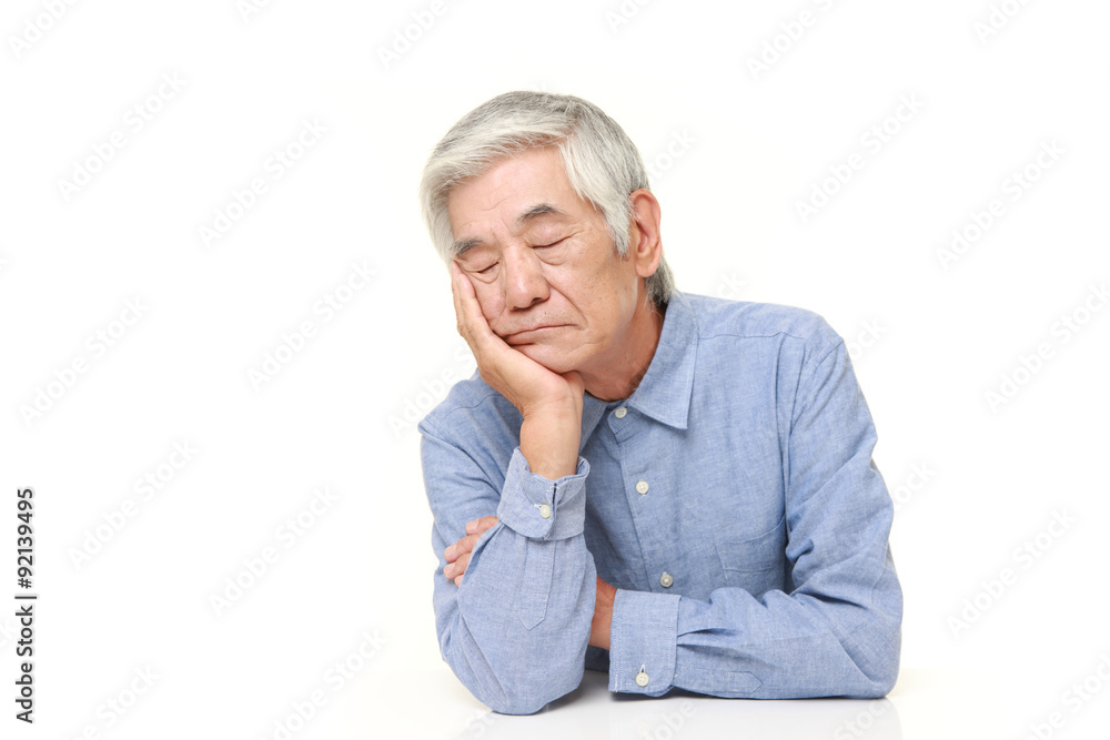 senior Japanese man sleeping on the table senior Japanese man sleeping on the table