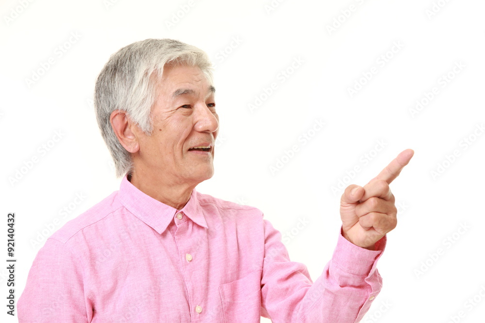 senior Japanese man presenting and showing something senior Japanese man presenting and showing something