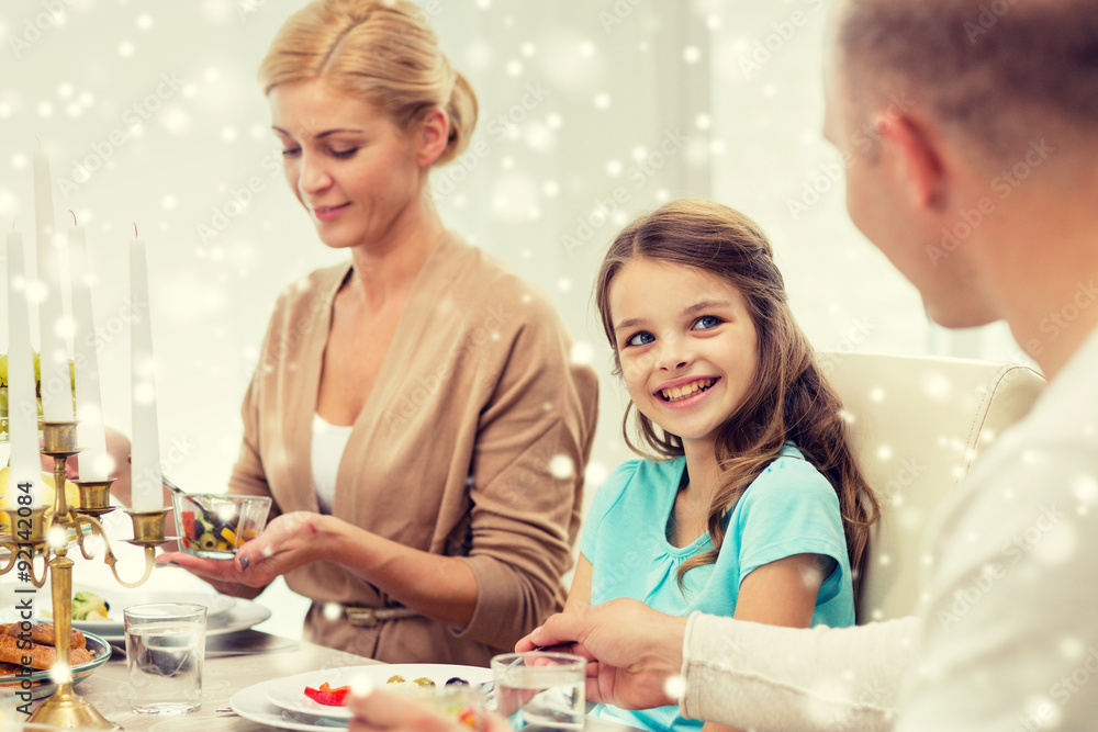 Fototapeta premium smiling family having holiday dinner at home