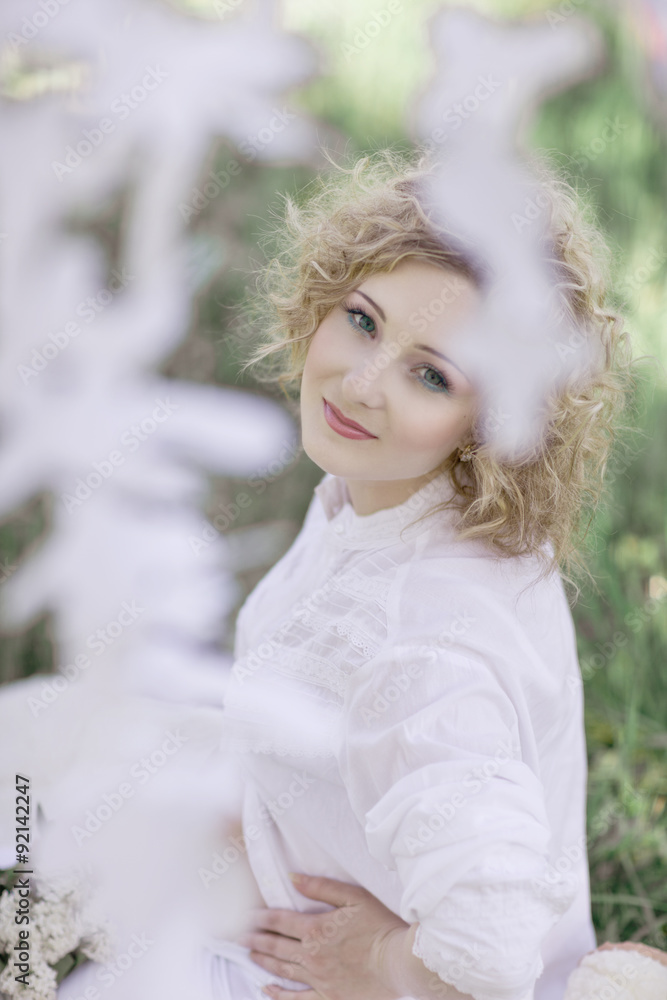 Naklejka premium beautiful face female enjoying cherry blossom