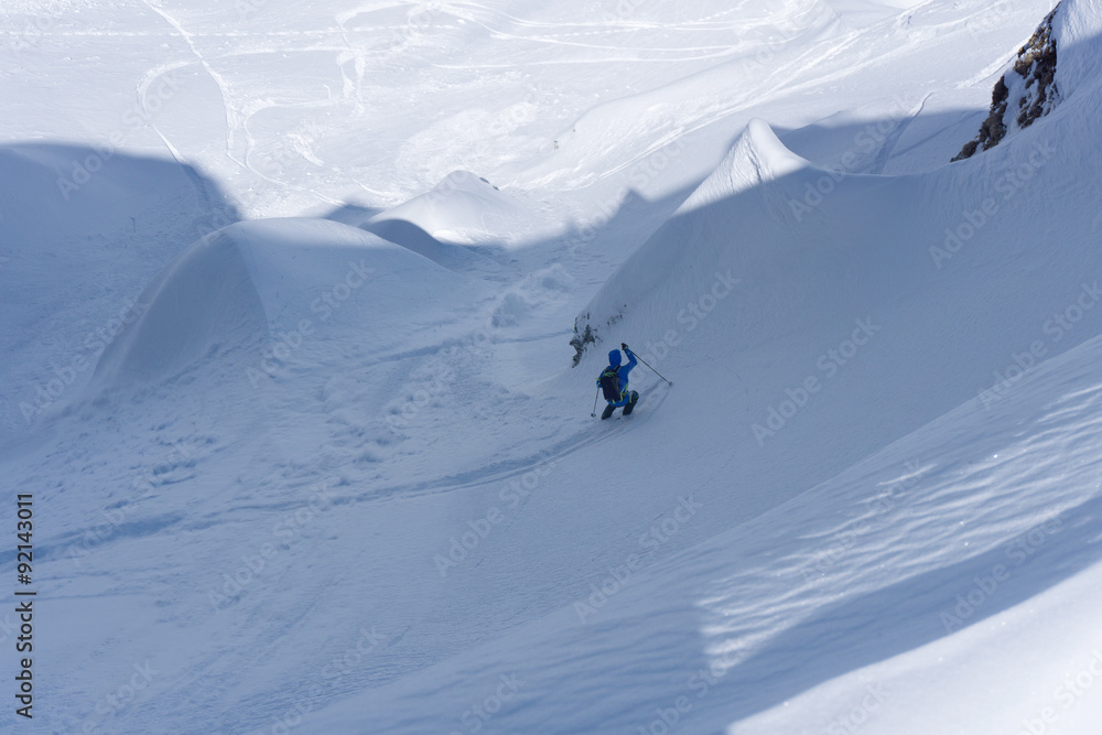 Skier in deep powder, extreme freeride Skier in deep powder, extreme freeride