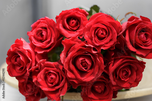 bouquet of red roses lying on a plate