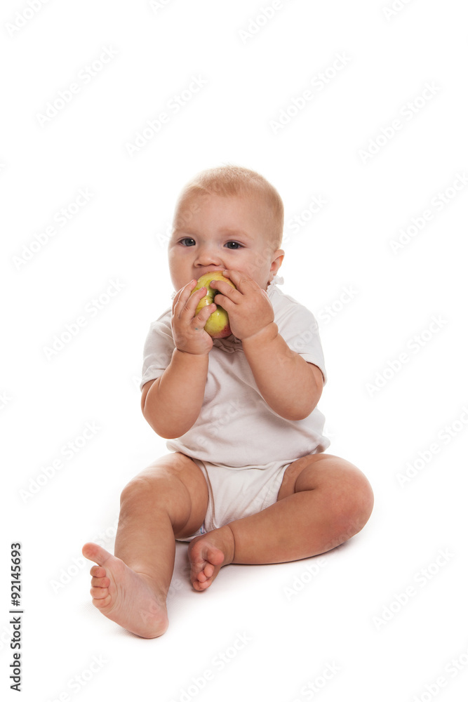 baby with an apple on a white background baby with an apple on a white background