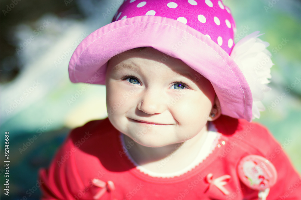 little girl in pink hat on a sunny day
little girl in pink hat on a sunny day