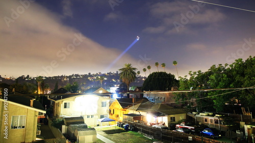  Time lapse footage with tilt up motion of LAPD Helicopter searching for suspect at night photo