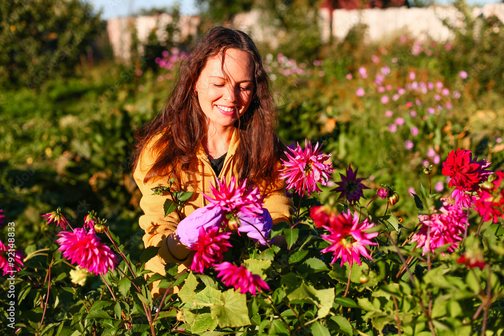 Young woman in garden. Young woman in garden.