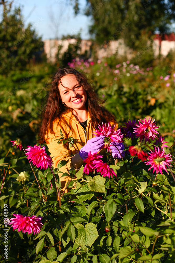 Naklejka premium Young woman in garden.