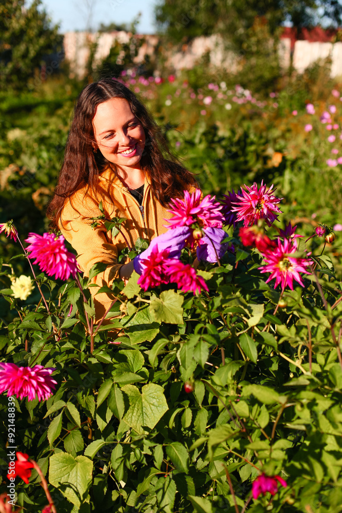 Young woman in garden. Young woman in garden.