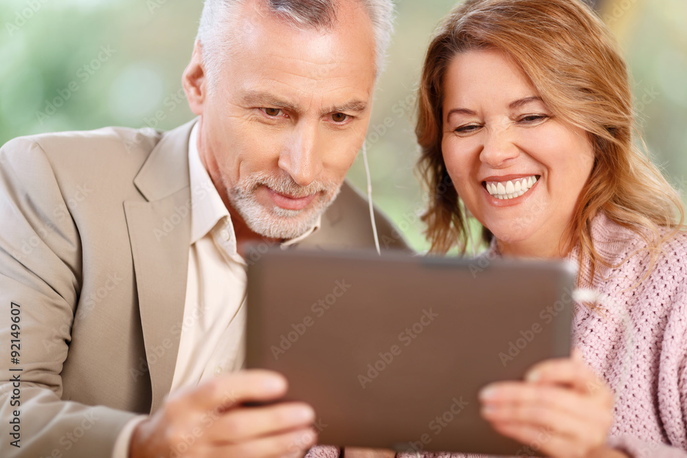Loving couple holding laptop. Loving couple holding laptop.