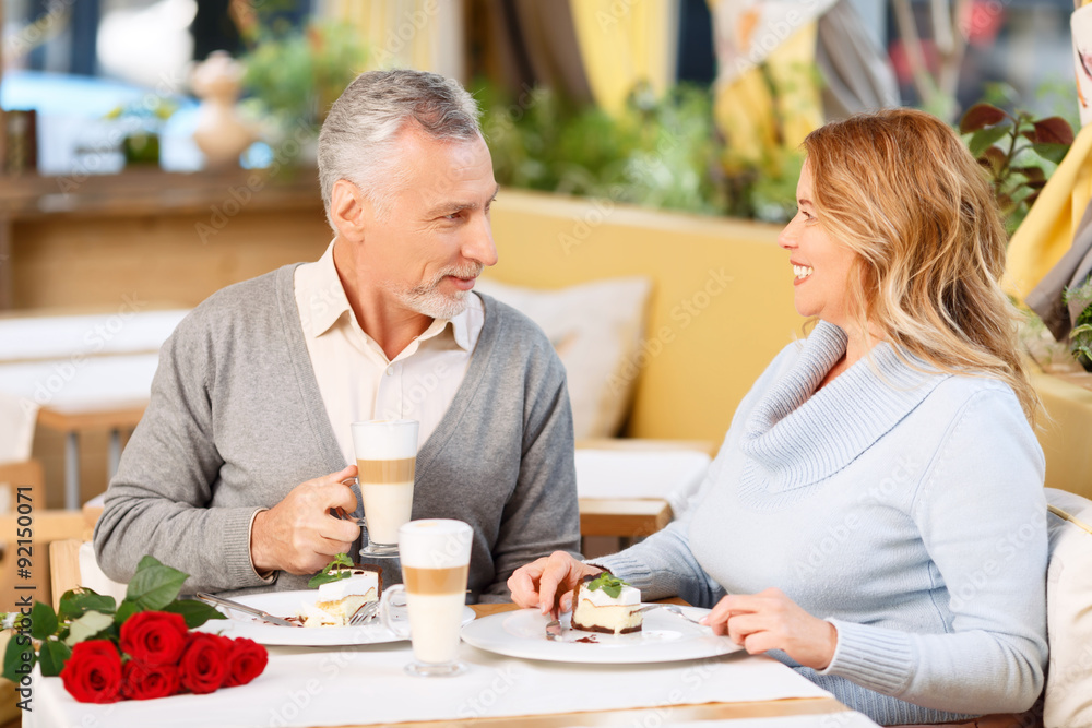 Nice adult couple sitting in the cafe Nice adult couple sitting in the cafe