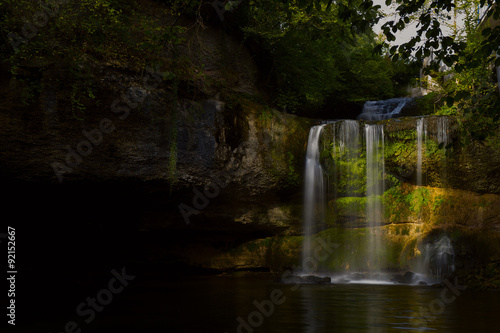 Waterfall near a cave 