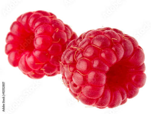 ripe raspberries isolated on white background close up
