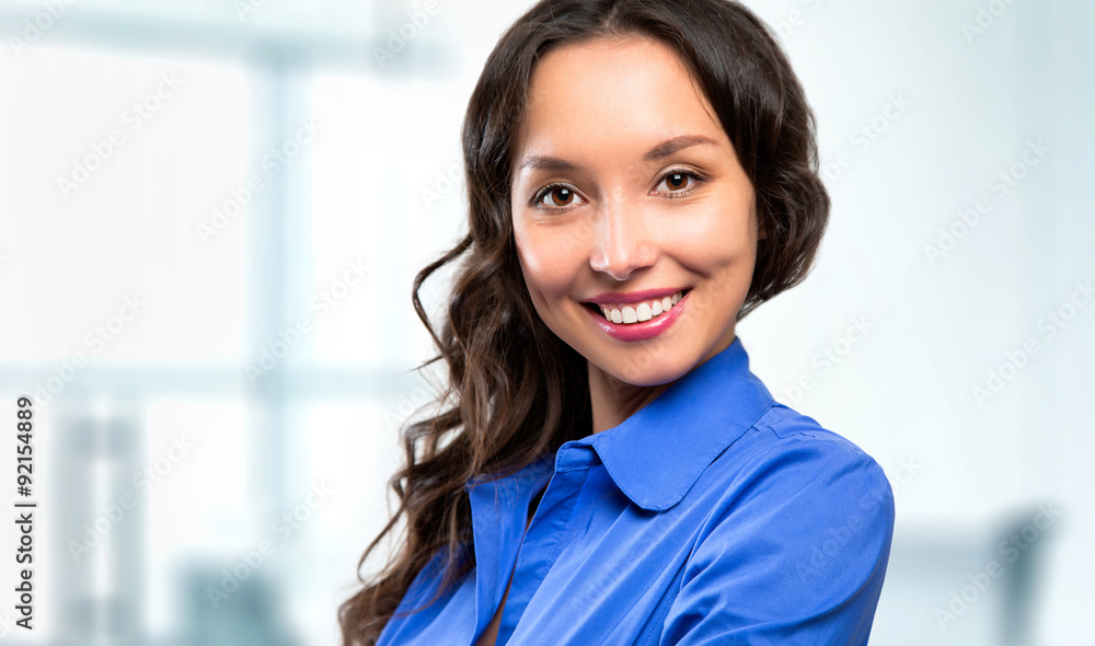 Successful business woman looking confident and smiling Successful business woman looking confident and smiling