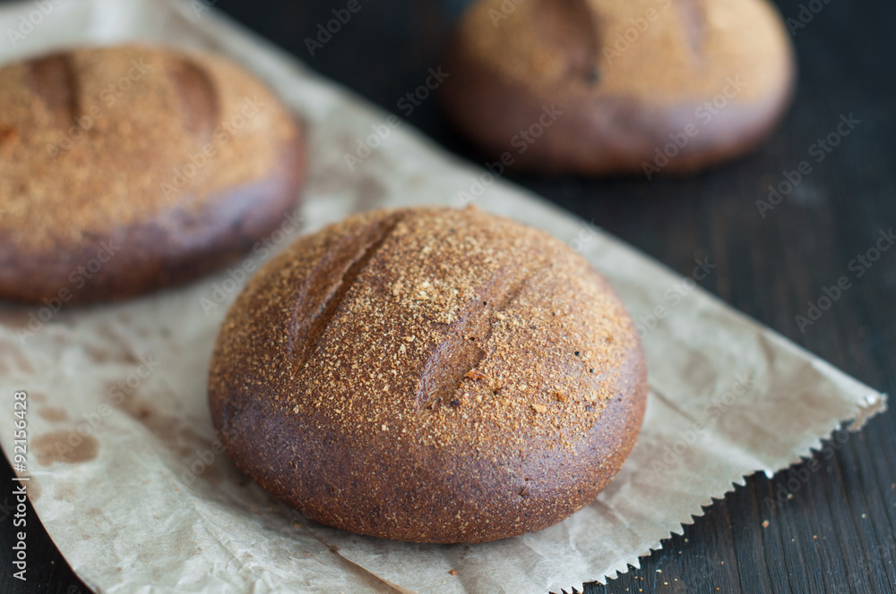 Round loaf of homemade brown wheat bread Round loaf of homemade brown wheat bread
