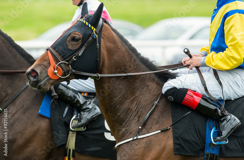 close up of jockeys on race horses