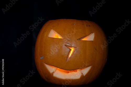 angry halloween pumpkin, black background © ncuisinier
