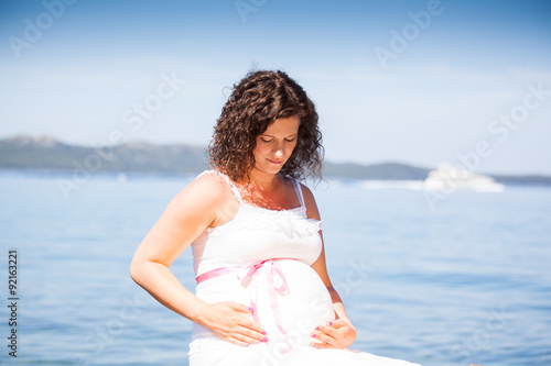 Quadro em tela Pregnant woman on the beach