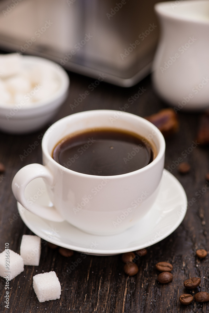 Braekfast in the morning, cup of black coffee, on the wooden tab Braekfast in the morning, cup of black coffee, on the wooden tab