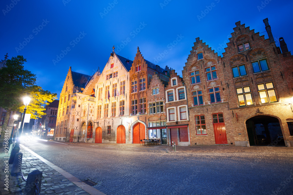 Cobblestone paved street at night in Bruges