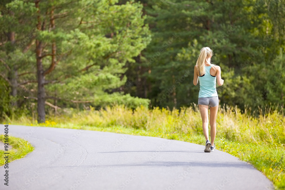 Young woman walking outdoor in the forest