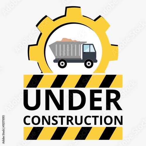 Truck with sand under construction sign