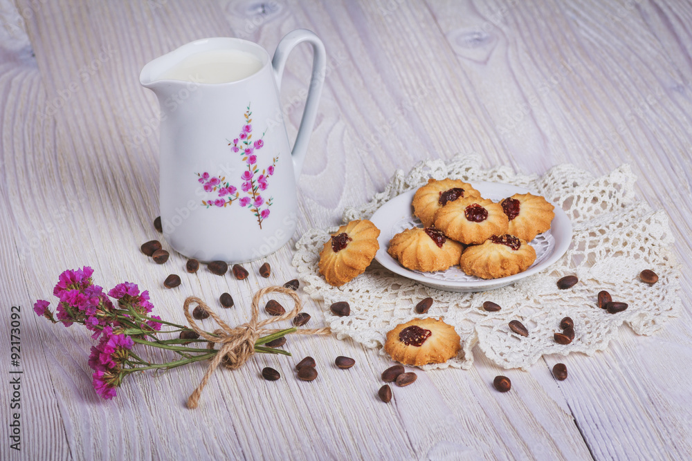 Jug with milk and cookie